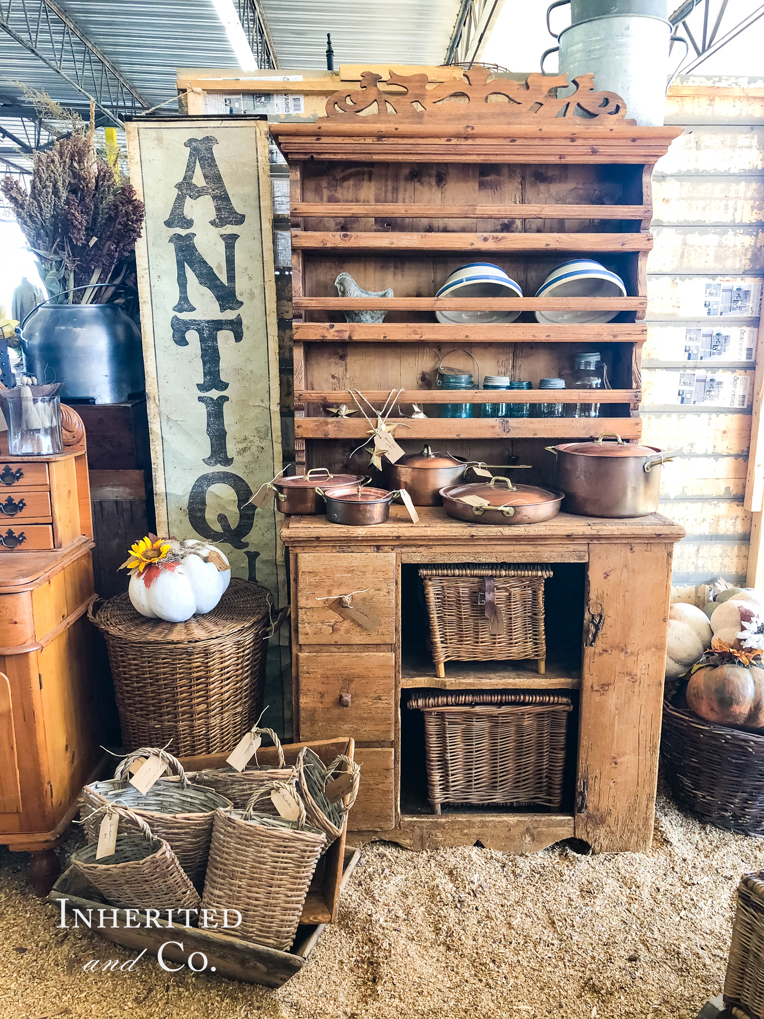English pine hutch filled with antiques in an antique booth