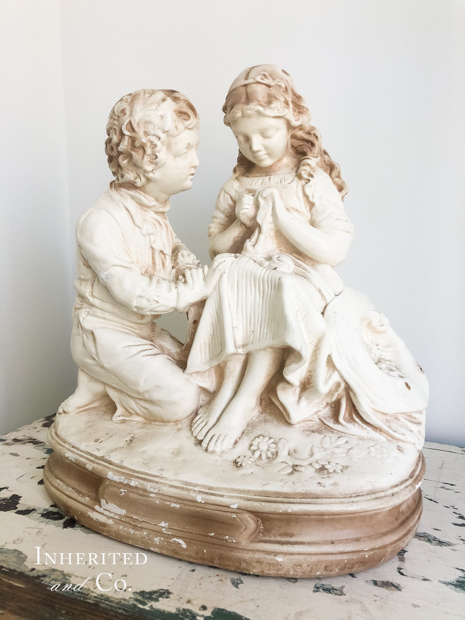 Vintage French sculpture of boy and girl