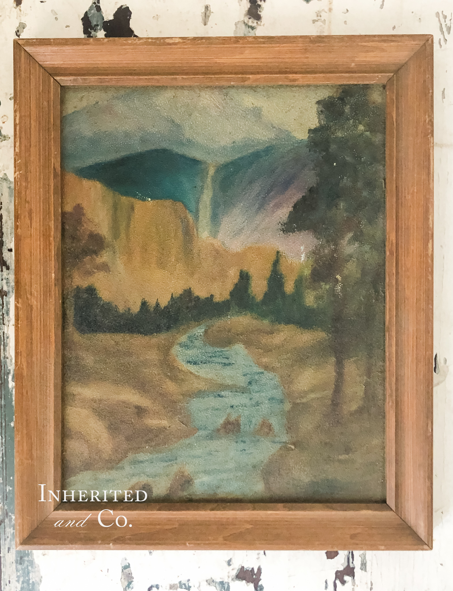 Vintage muted painting of waterfall in wood picture frame