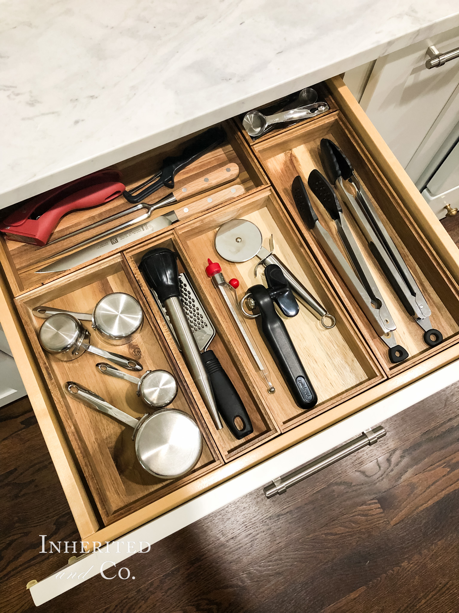 Organized kitchen gadget drawer with wooden containers
