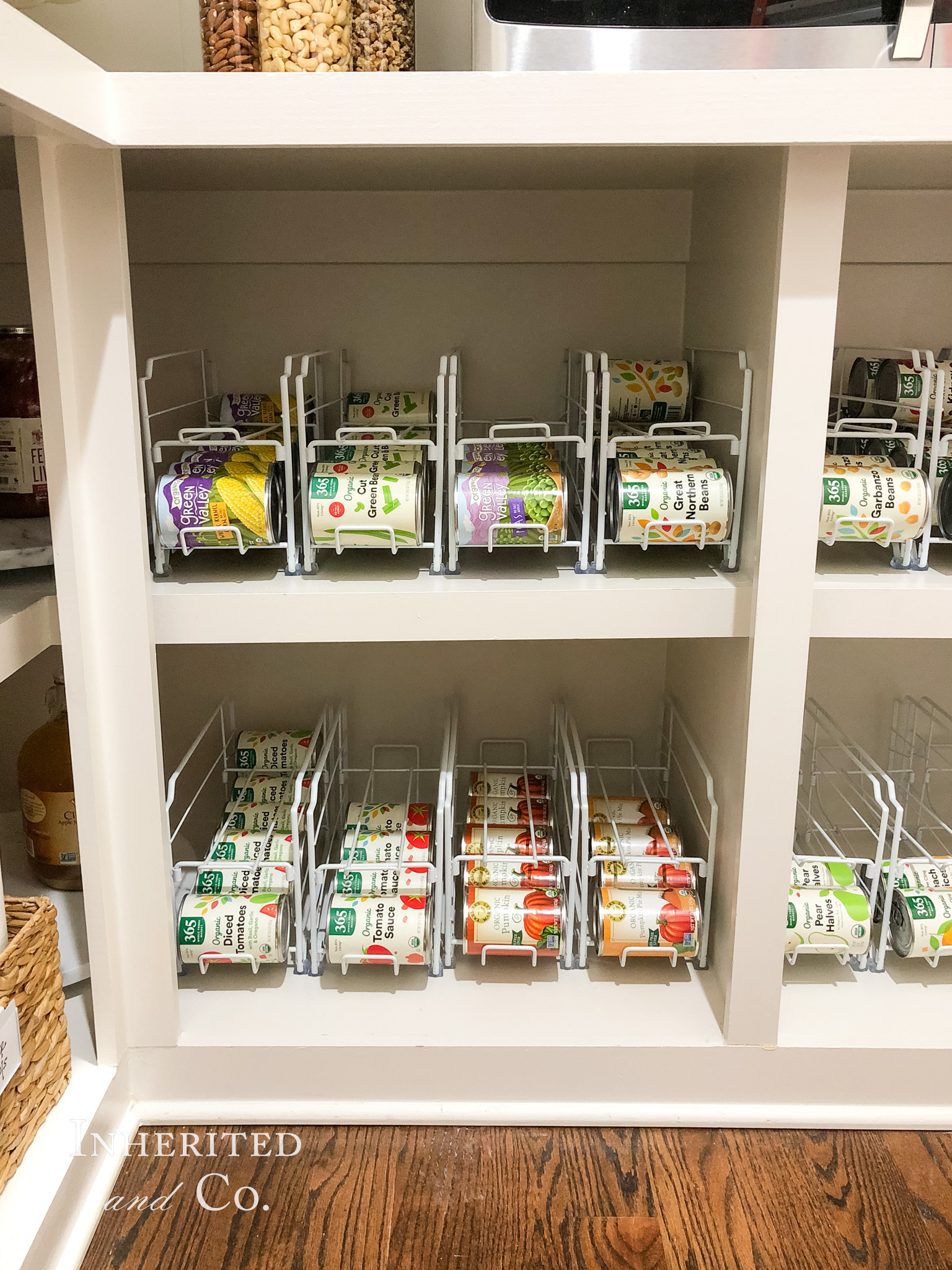 two rows of canned food in metal organizers