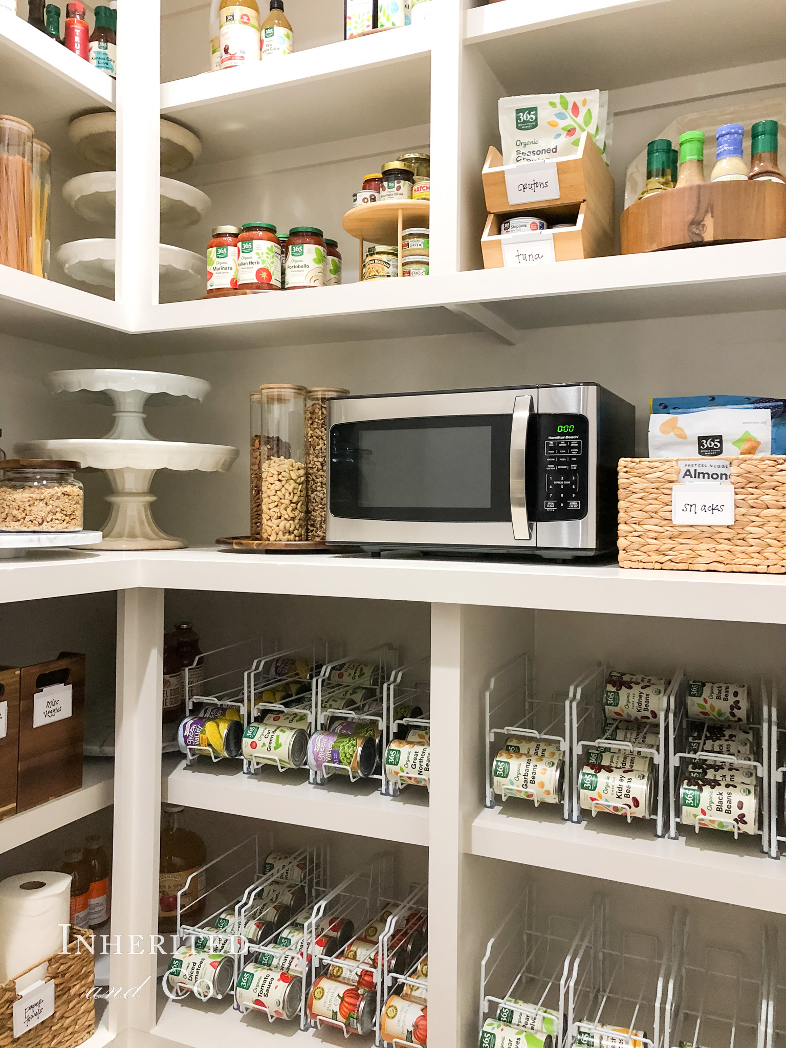 organized pantry shelves, featuring a countertop microwave