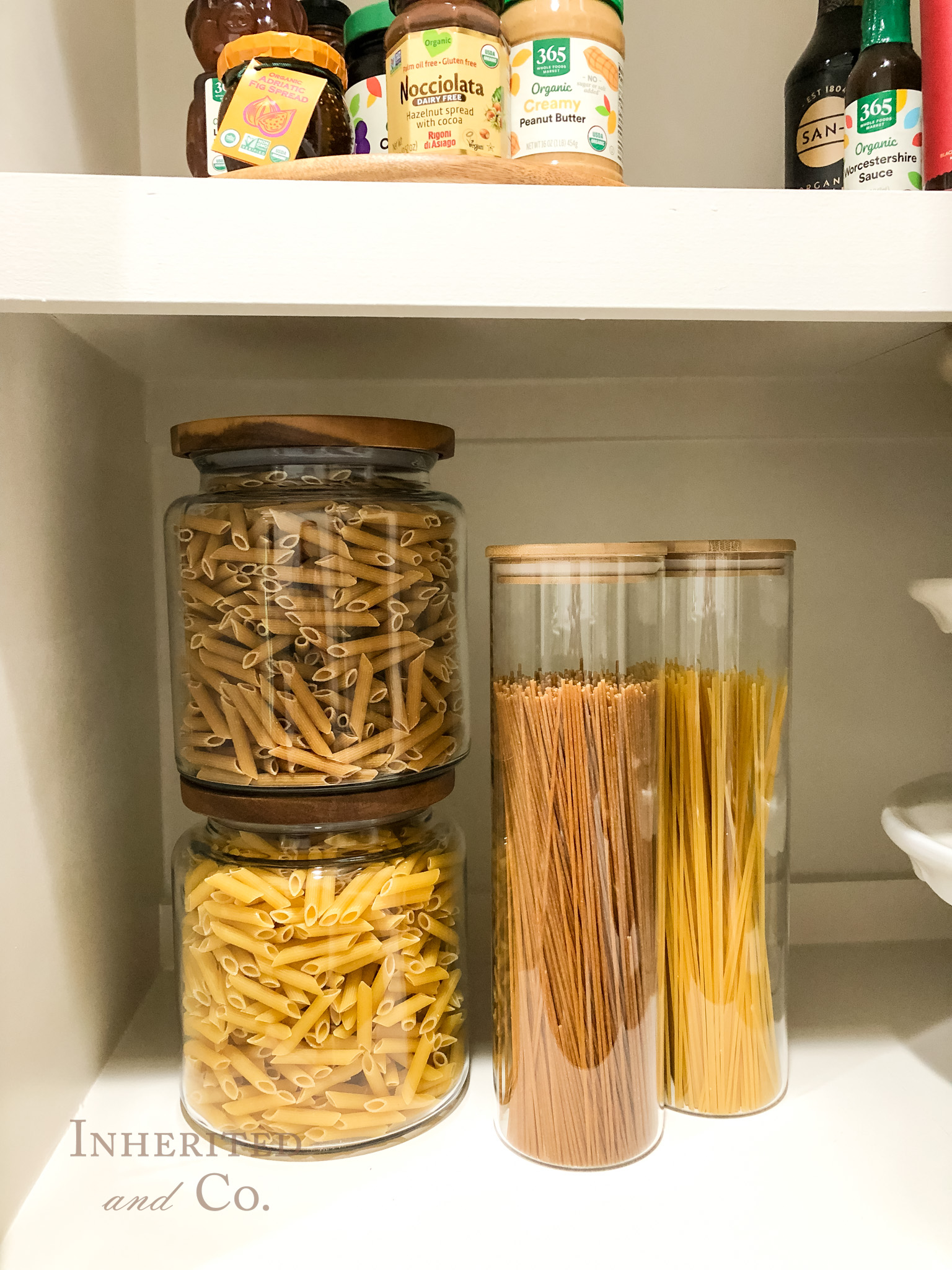 whole wheat and regular pasta in glass jars