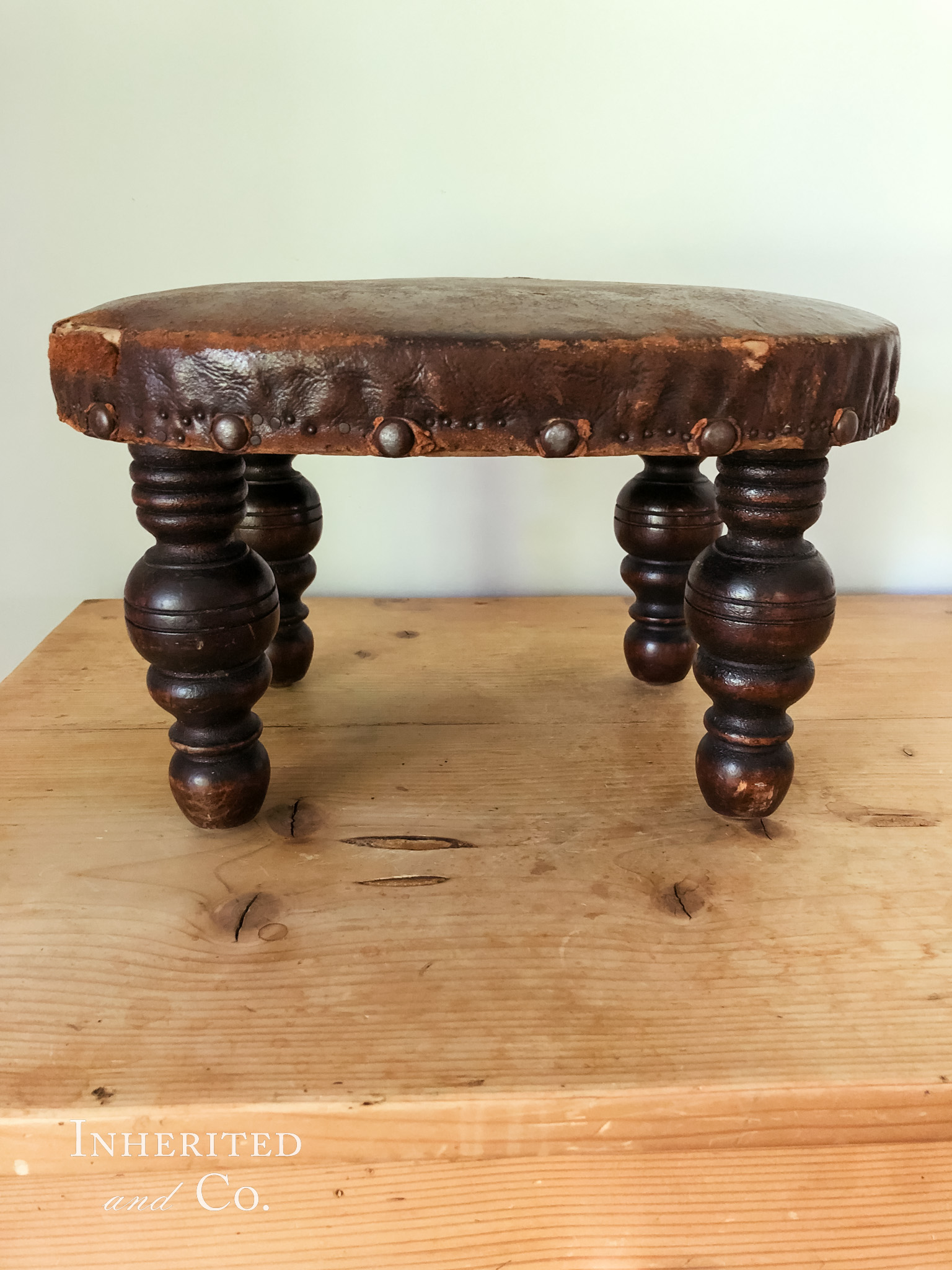 Leather footstool from Backroad Antiques