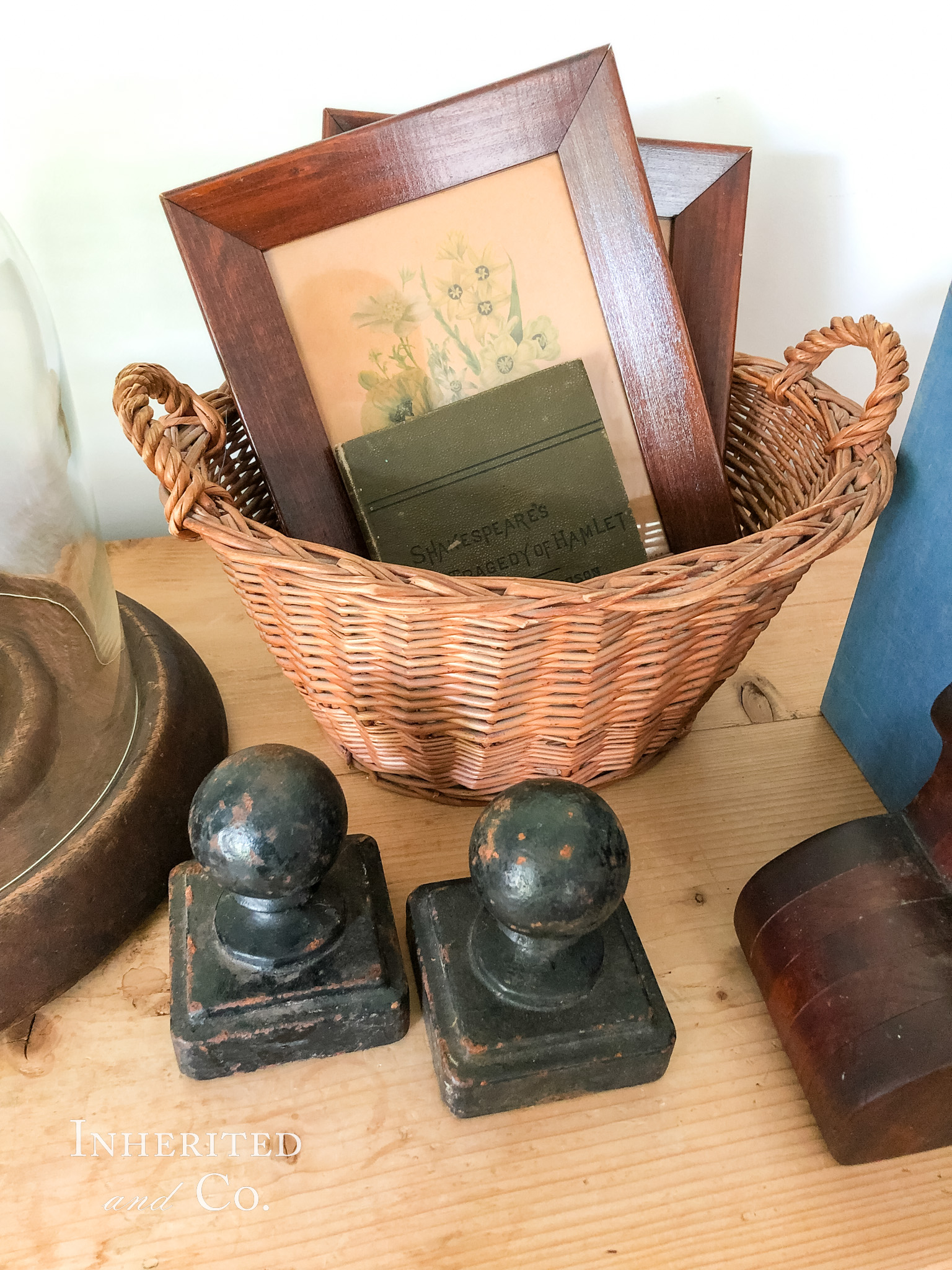 Vintage basket, frames, and cast iron finials