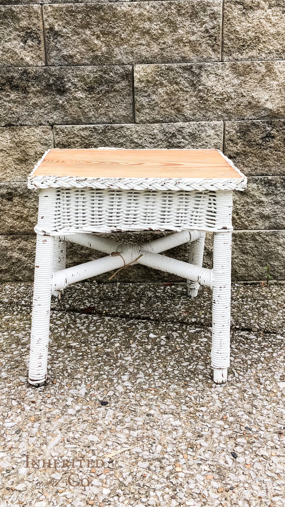 Chippy white, wicker stool found at Vintage Pickin' Spring Market
