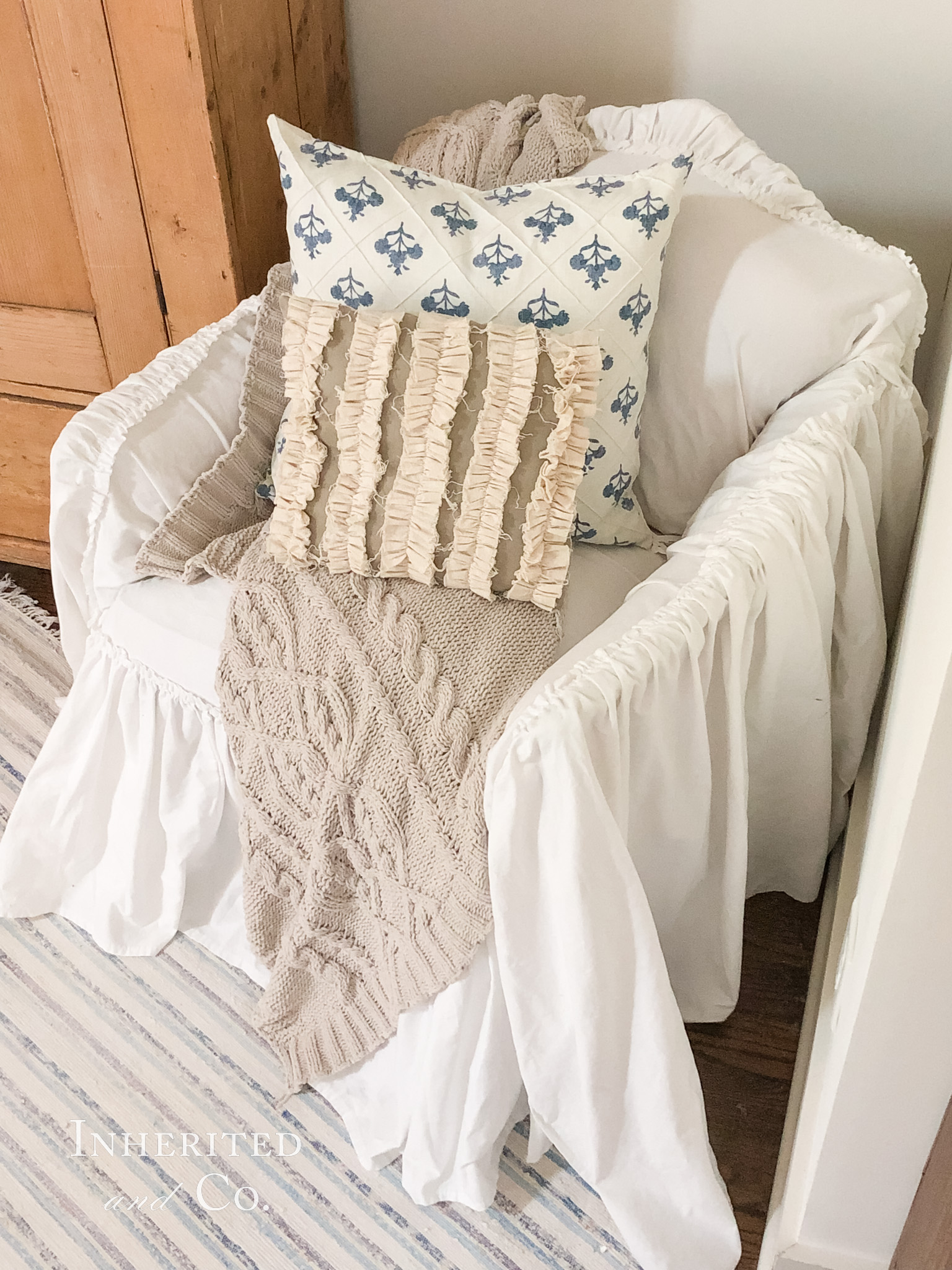 Ruffled white slipcover on a vintage chair