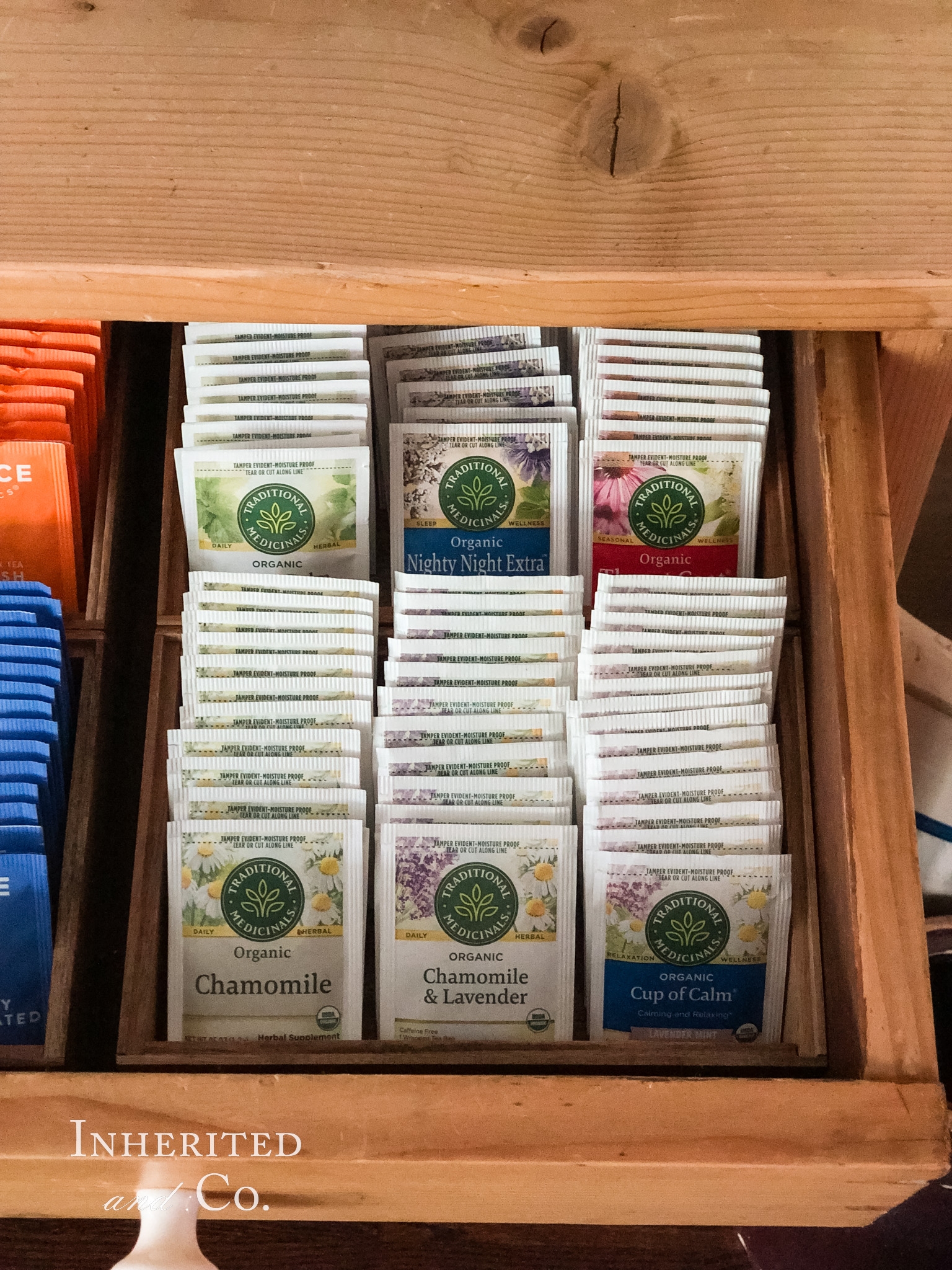Traditional Medicinals teas organized in a drawer of an antique cabinet