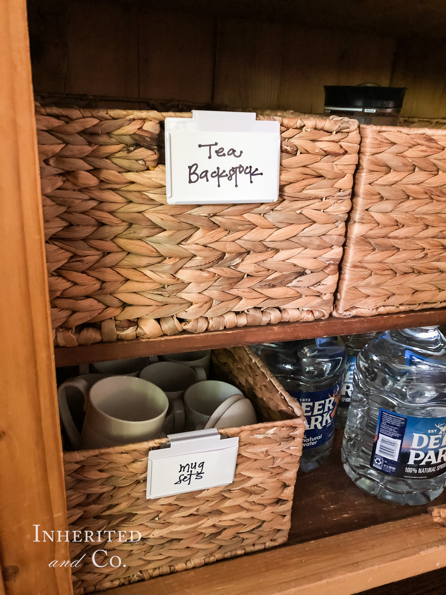 Basket in an antique cabinet home coffee bar filled with tea backstock