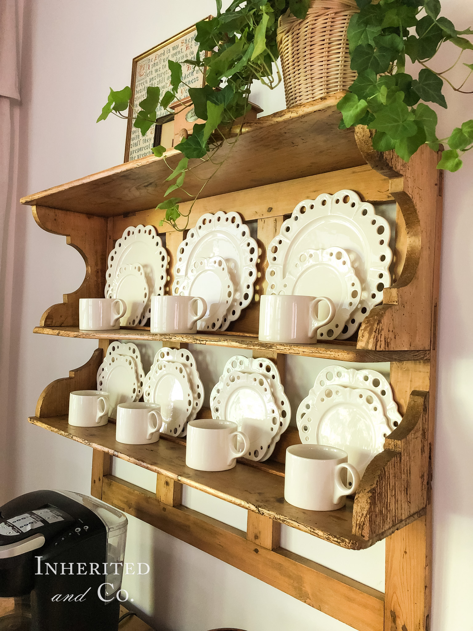 Eyelet plates and mugs on an antique English pine plate rack