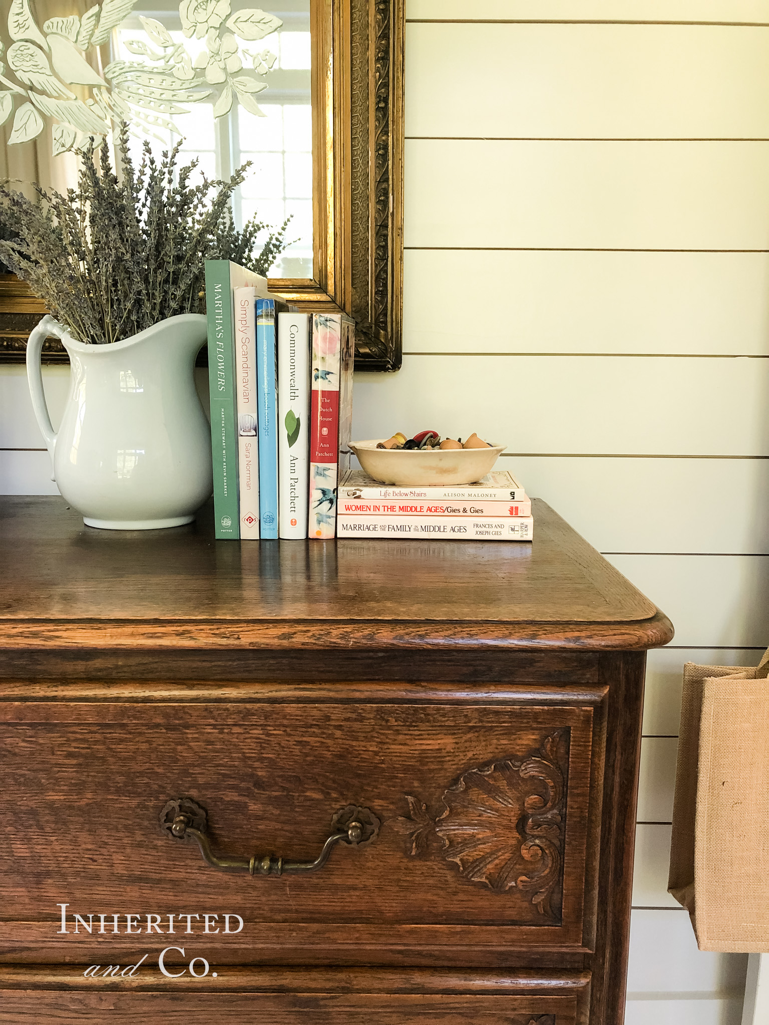 Ironstone and books from McKay's Used Bookstore Nashville atop an antique French dresser