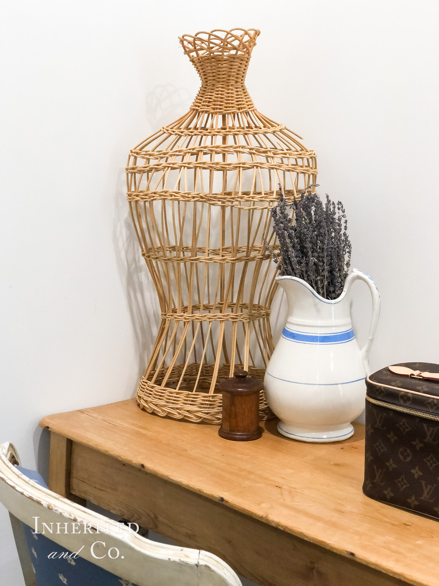 Vintage Wicker Mannequin with an ironstone pitcher and early treen