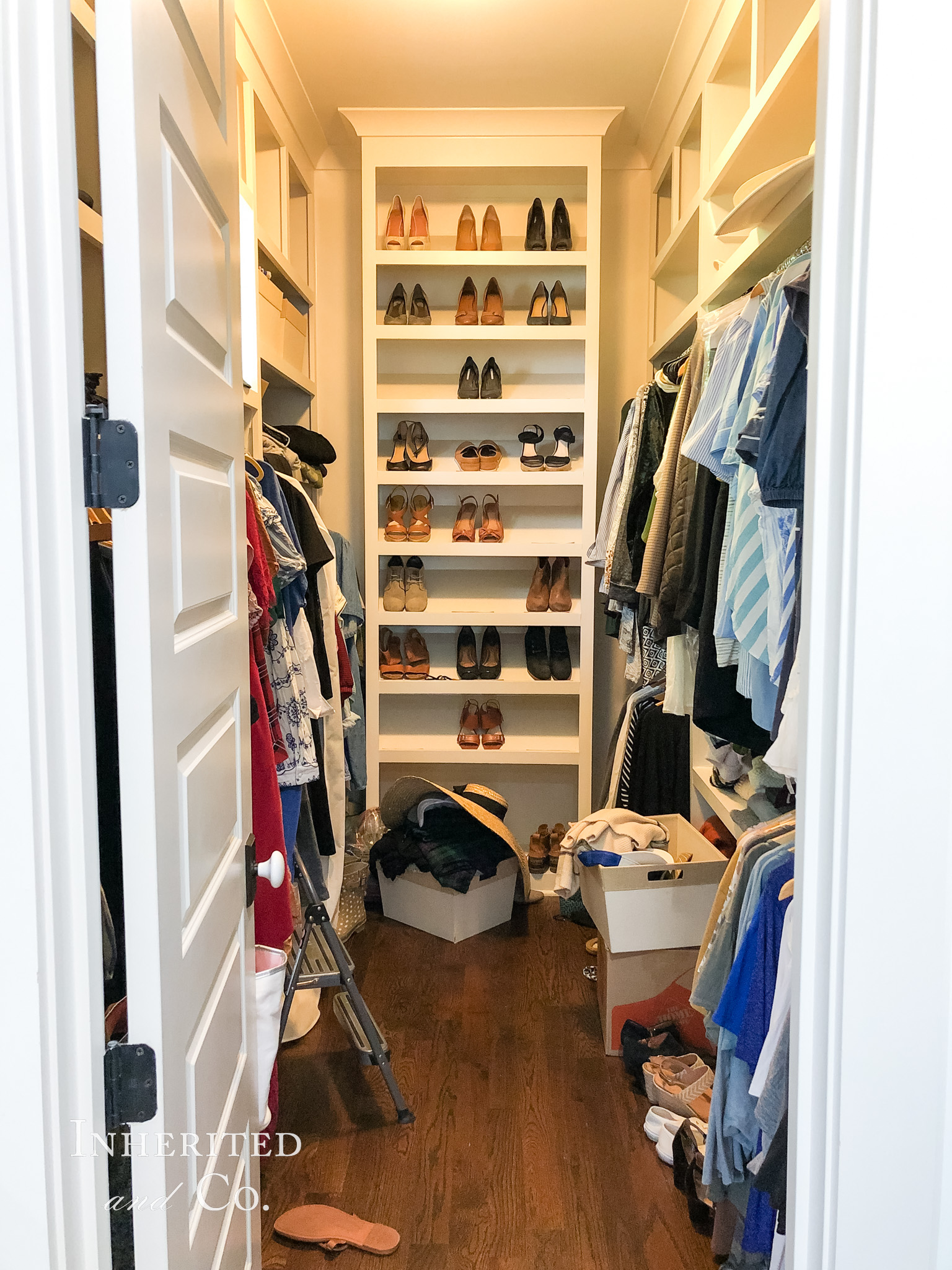 Before photo of a disorganized walk-in closet