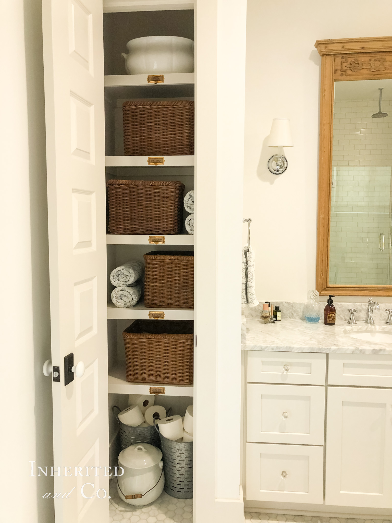 Primary Bathroom with an organized linen closet, featuring antiques and baskets