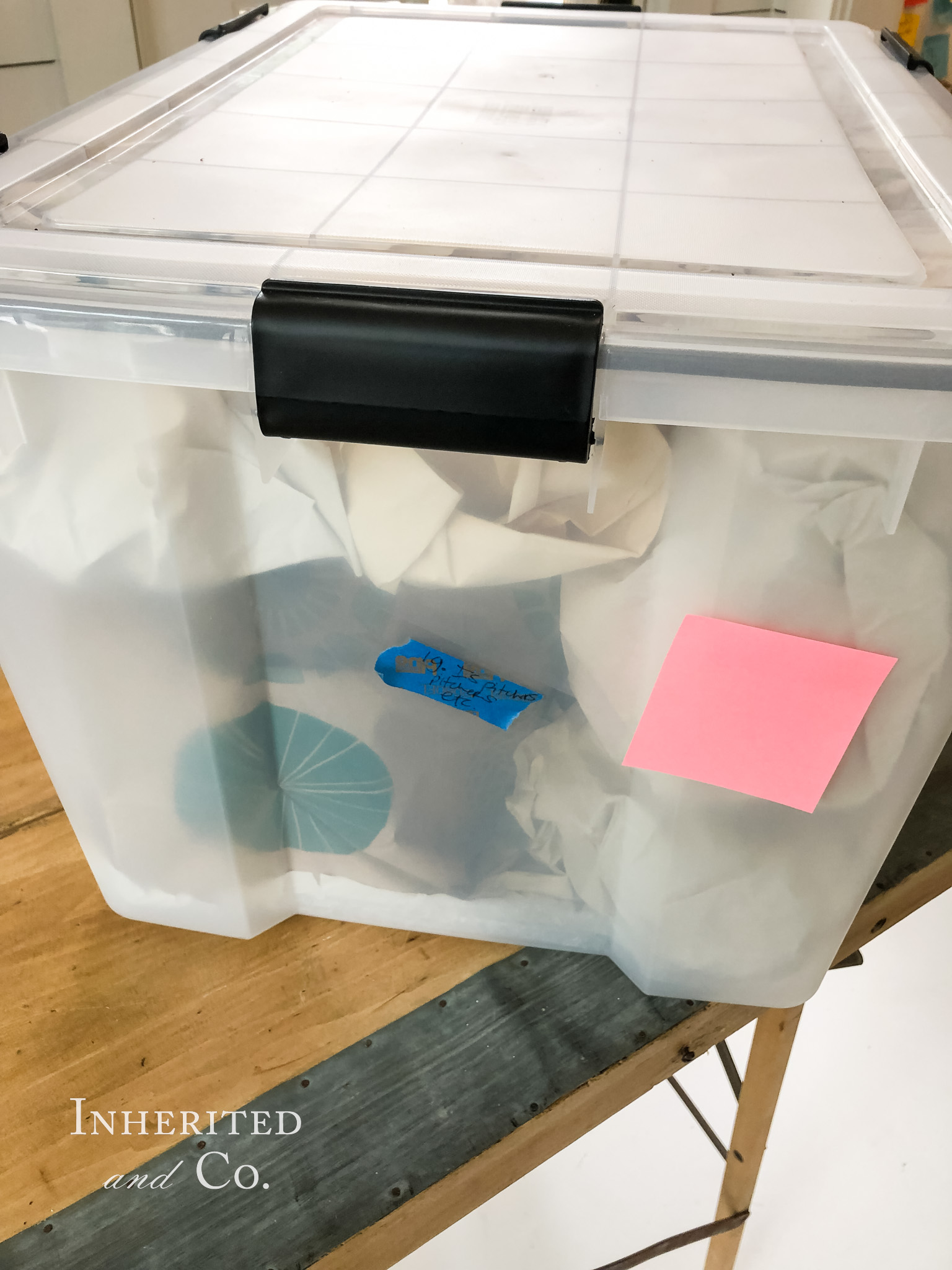 Plastic bin filled with ironstone pitchers