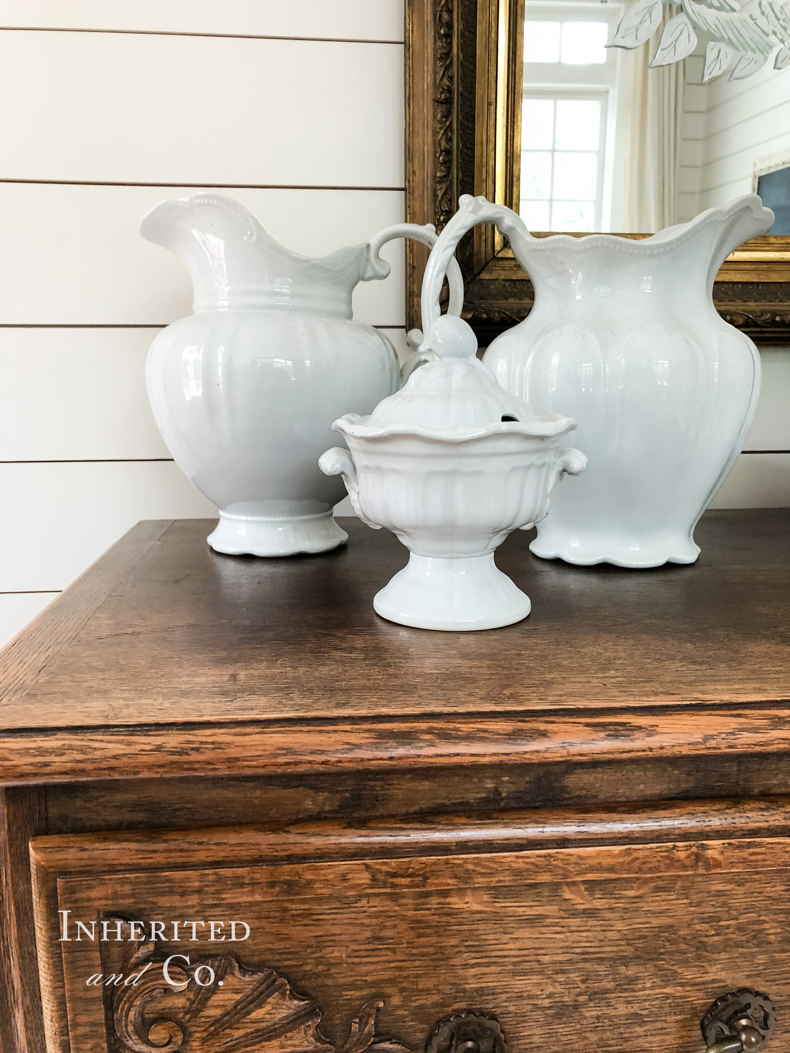 Two ironstone ewers and a sauce tureen