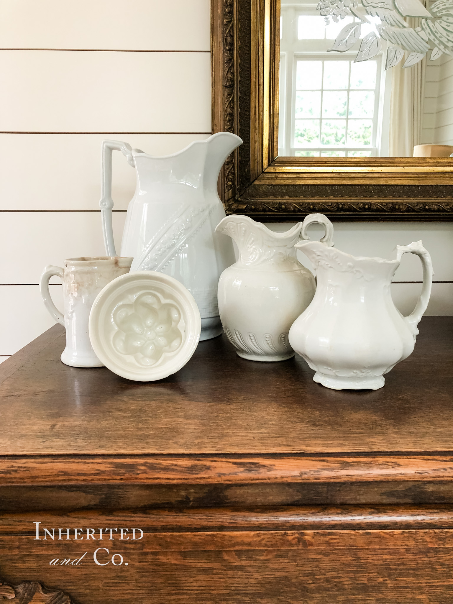 Basketweave ironstone pitcher, ironstone mold, two ironstone pitchers, and a lidless ironstone syrup pitcher