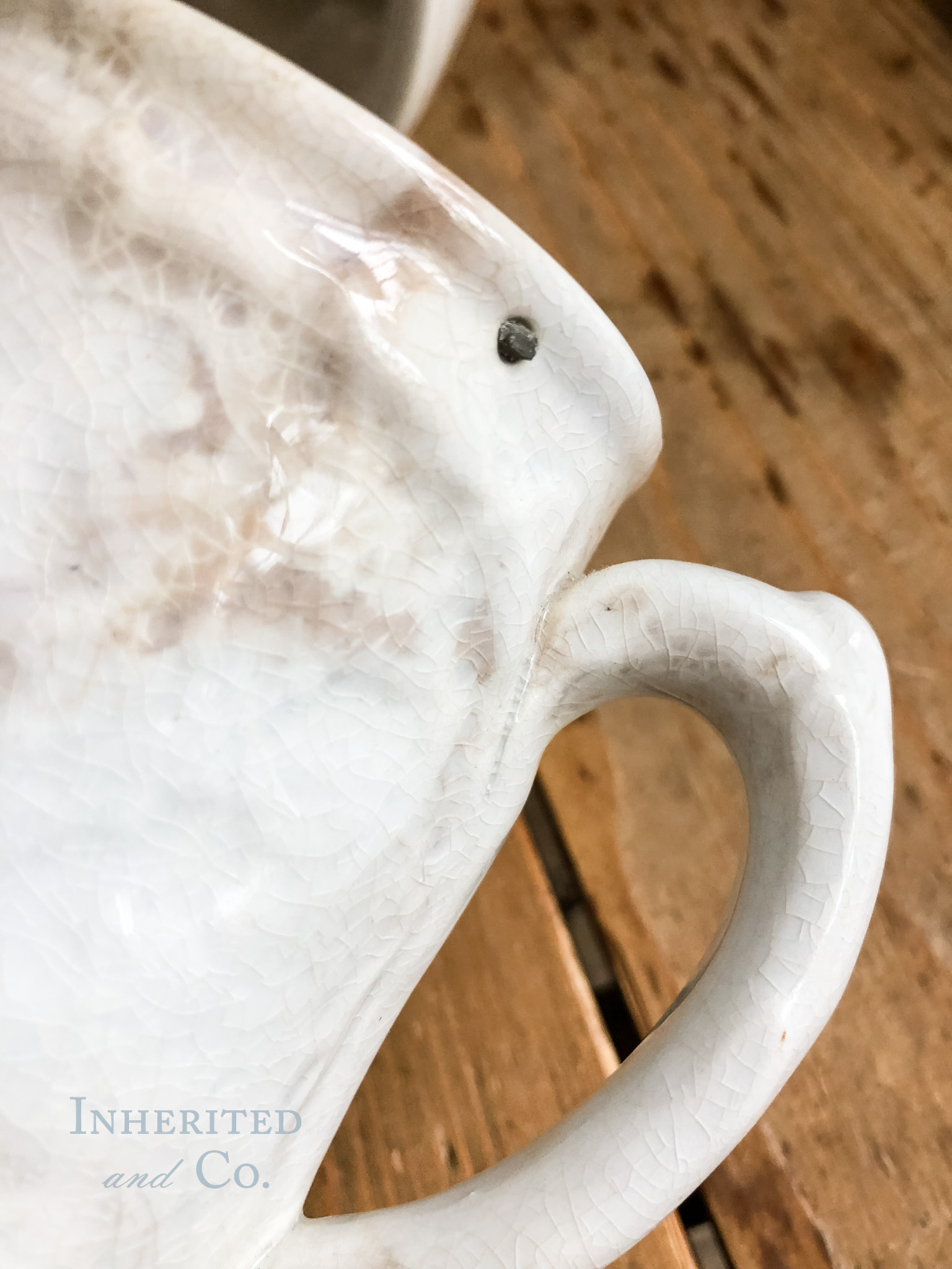 Pewter rivet in ironstone syrup pitcher