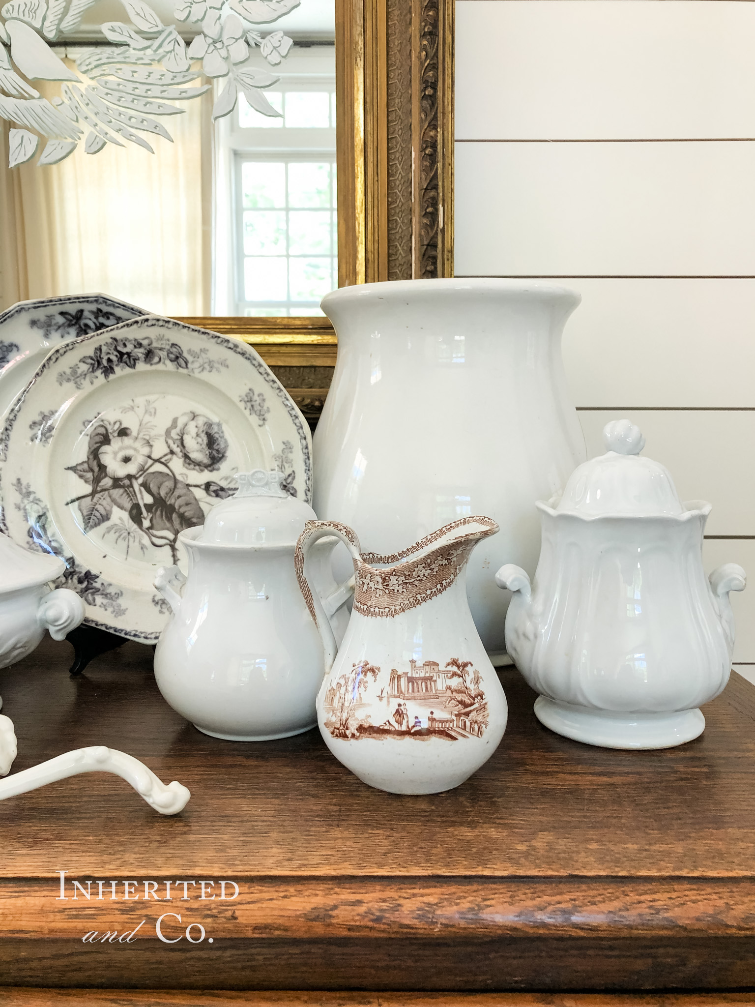 An ironstone jardinière, brown transferware pitcher, mulberry plates, and a sugar bowl