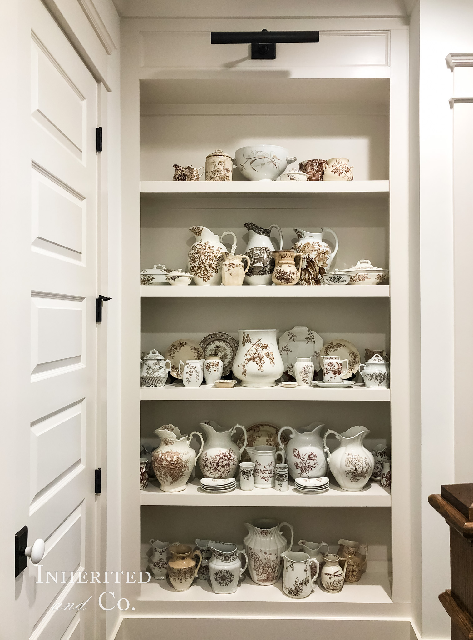 An assigned bookshelf to hold antique brown transferware and keep this antique collection manageable.