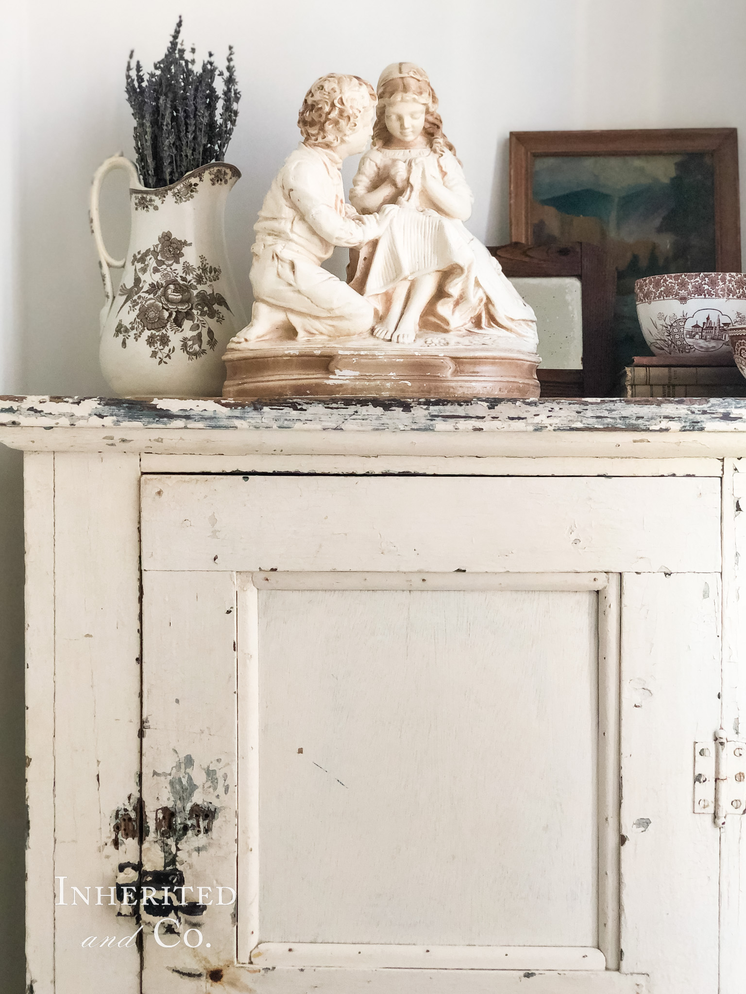 Antique Jelly Cupboard topped with brown transferware and vintage art